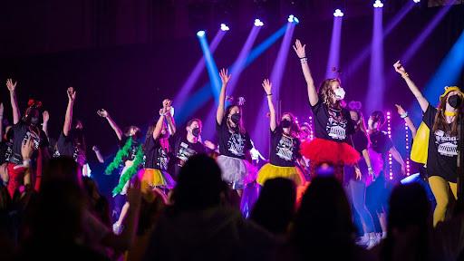 Terp Thon steering committee members lead a “power hour” to pump up the tired crowd nearing the end of the annual fundraiser for Children’s National Hospital on March 12, 2022, at Reckord Armory. Photo by Stephanie S. Cordle